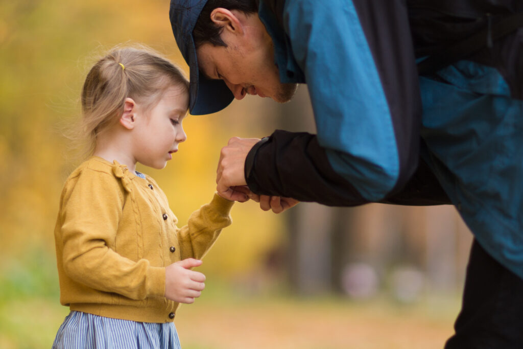 dad helps daughter. father and child. parent examines hand.