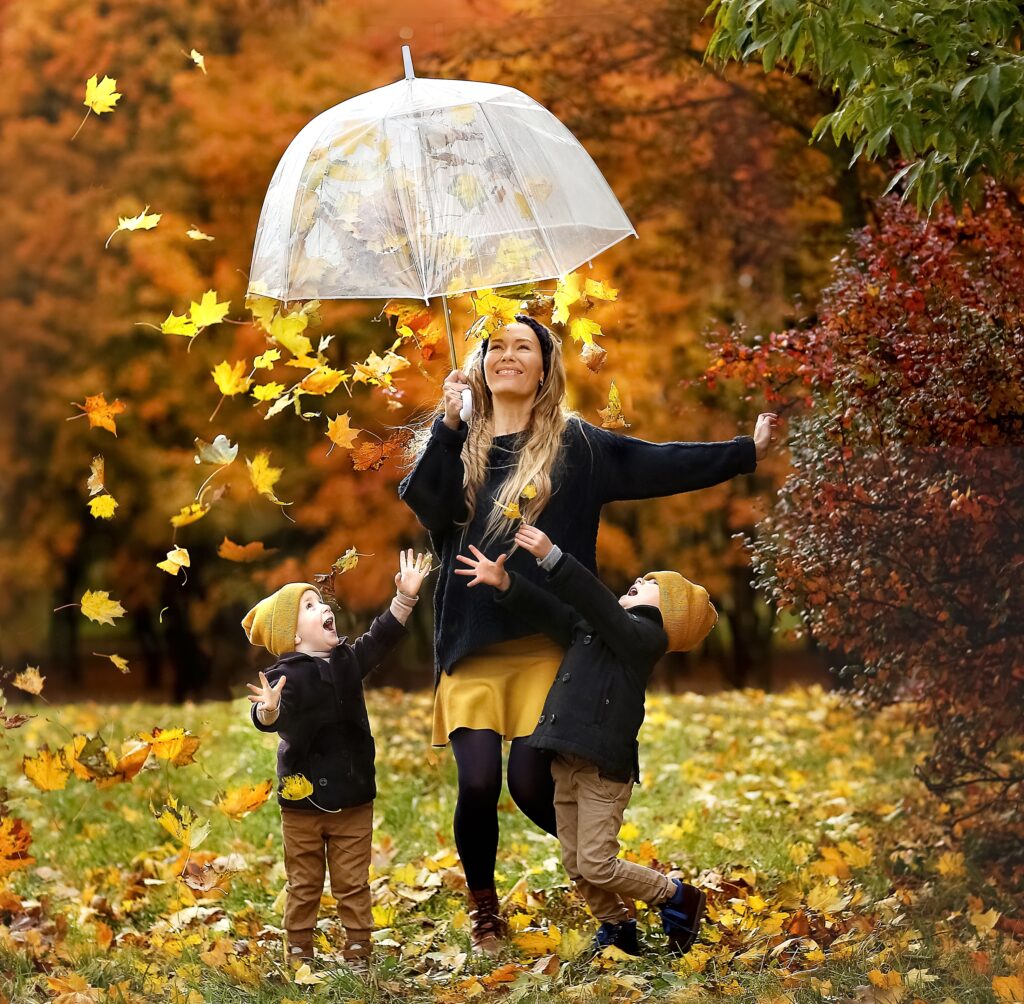 woman-and-children-playing-with-leaves-in-autumn-2026-09-21-13-06-04-utc